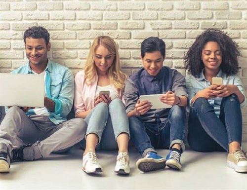 Students looking at their iPhones